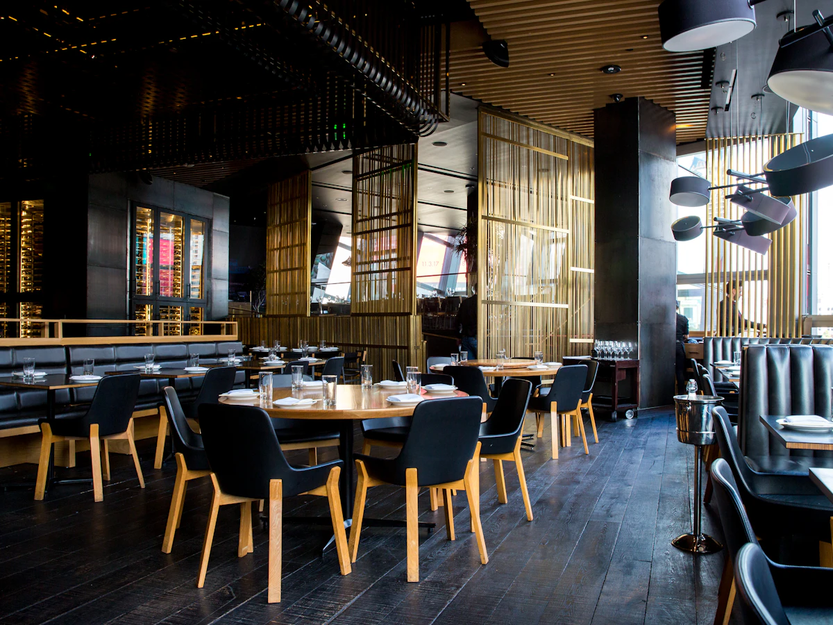 Inside a Burger Aiman outlet: dark wood, brass and booth seating