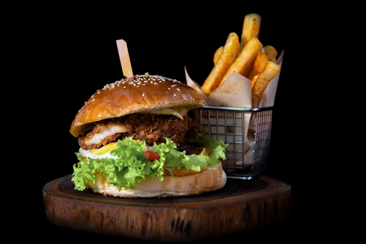 A brioche burger and a basket of fries