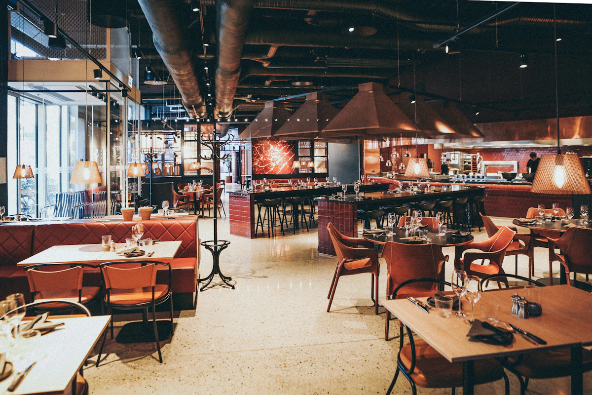 The Subang Jaya outlet: red booths under copper lamps